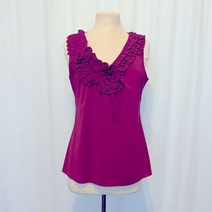 Floral & ruffle trimmed fuschia colored sleeveless top.